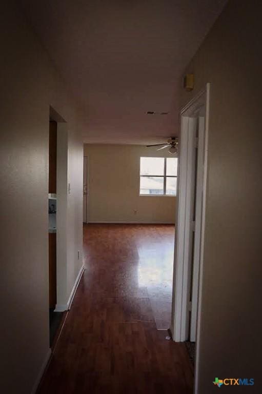 hall featuring dark wood-type flooring