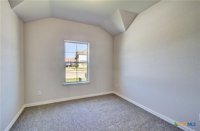 2588 Gideon Ln, New Braunfels, TX 78130 - carpeted empty room featuring lofted ceiling and baseboards
