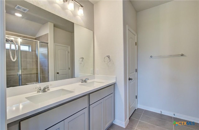 2588 Gideon Ln, New Braunfels, TX 78130 - bathroom with double vanity, tile patterned floors, a shower stall, and lofted ceiling