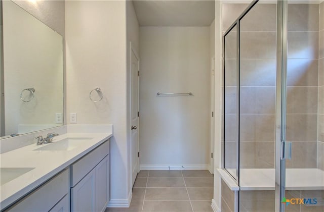 2588 Gideon Ln, New Braunfels, TX 78130 - bathroom featuring double vanity, a stall shower, and tile patterned flooring