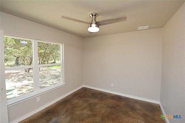 carpeted empty room featuring ceiling fan