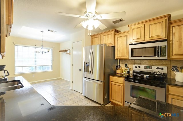 408 Sterling Manor Ct, Temple, TX 76502 - kitchen featuring appliances with stainless steel finishes, decorative backsplash, a chandelier, a ceiling fan, and pendant lighting