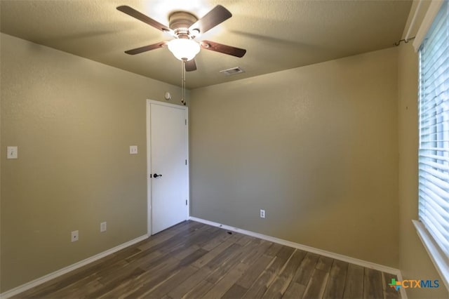 408 Sterling Manor Ct, Temple, TX 76502 - spare room with ceiling fan, dark wood finished floors, and plenty of natural light