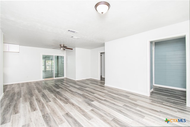 spare room with ceiling fan and light hardwood / wood-style flooring