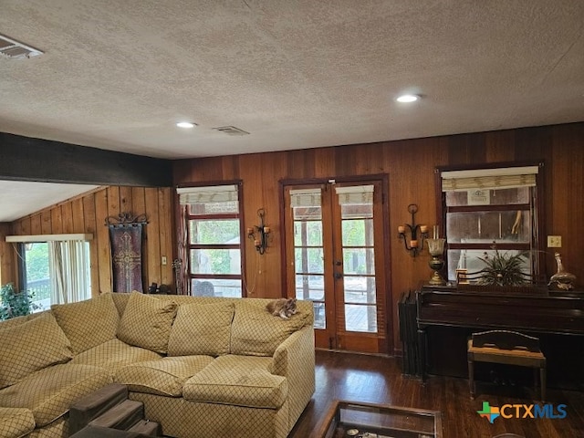263 E Garden St, New Braunfels, TX 78130 - living area featuring wood walls, wood finished floors, french doors, a textured ceiling, and recessed lighting