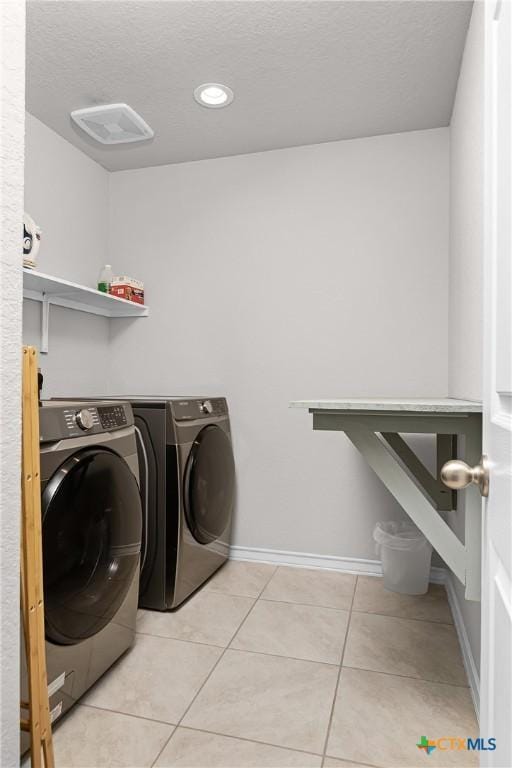 laundry room with washer and dryer, recessed lighting, light tile patterned flooring, baseboards, and laundry area