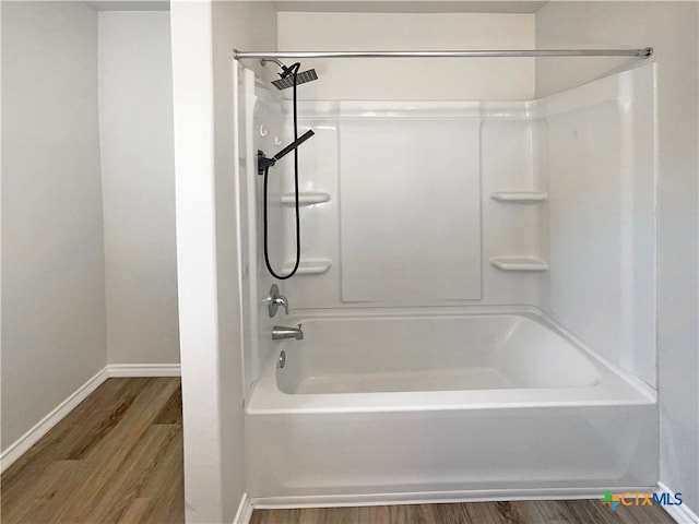 bathroom featuring shower / bathtub combination and wood-type flooring