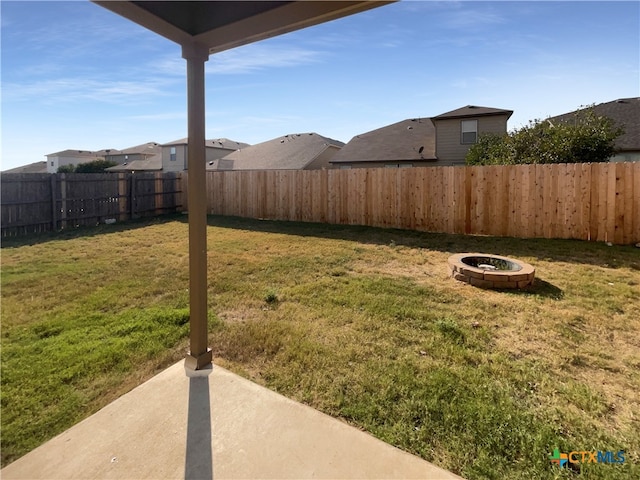 view of yard featuring a fire pit and a patio area