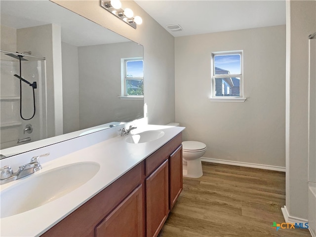 full bathroom with shower with separate bathtub, vanity, hardwood / wood-style flooring, and plenty of natural light