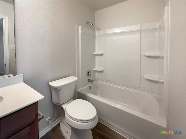 full bathroom featuring hardwood / wood-style floors, vanity, toilet, and shower / bathtub combination