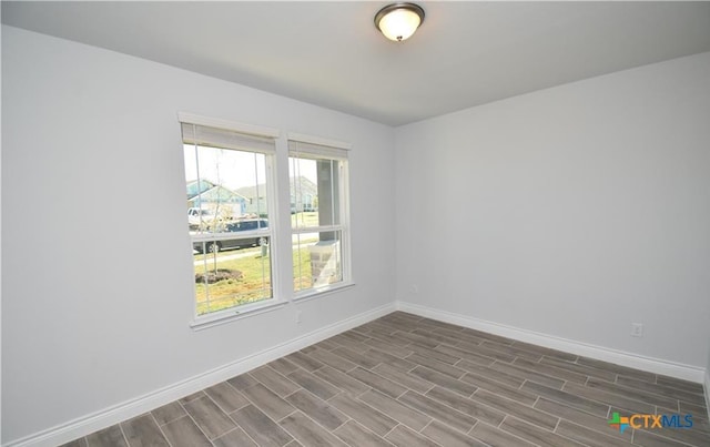 empty room with wood-type flooring