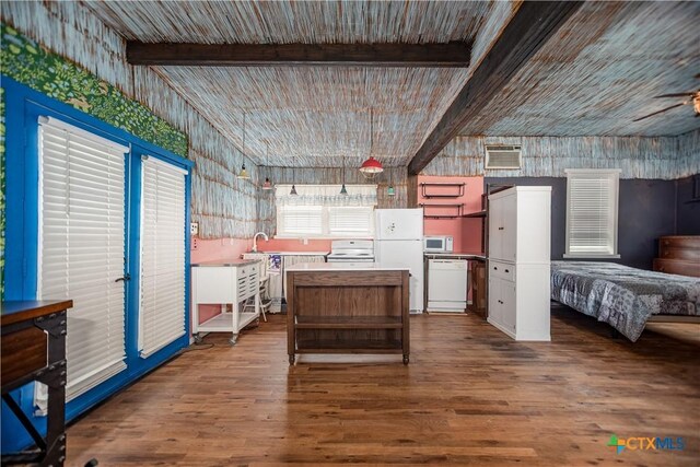 126 Washington Ave, Port Lavaca, TX 77979 - kitchen with white appliances, dark wood-style floors, white cabinets, open floor plan, and light countertops