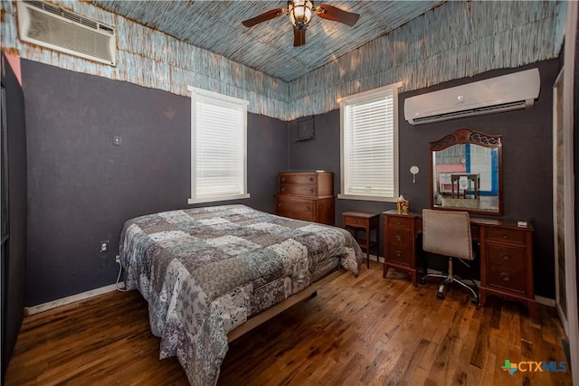 126 Washington Ave, Port Lavaca, TX 77979 - bedroom with a wall mounted AC, wood finished floors, a wall unit AC, baseboards, and a ceiling fan