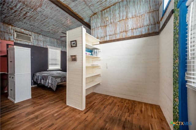 126 Washington Ave, Port Lavaca, TX 77979 - bedroom featuring a wall mounted AC and wood finished floors