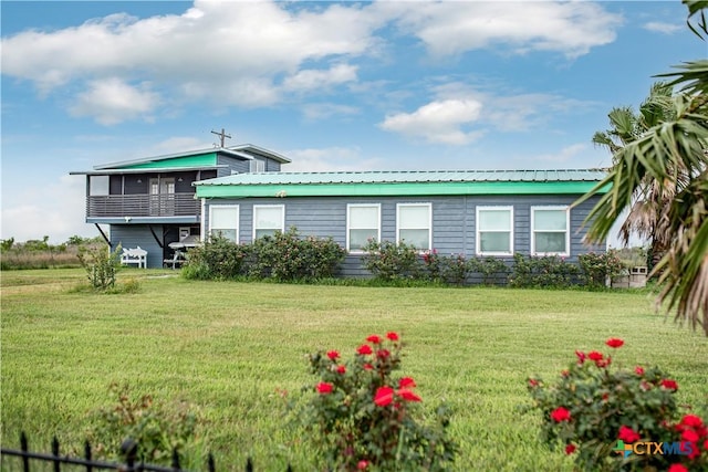 126 Washington Ave, Port Lavaca, TX 77979 - view of front of house with a front yard and metal roof
