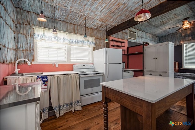 126 Washington Ave, Port Lavaca, TX 77979 - kitchen with white appliances, wood finished floors, a ceiling fan, pendant lighting, and a sink