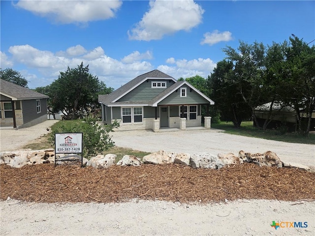 905 Roadrunner Spur, Canyon Lake, TX 78133 - view of front of house featuring a porch and driveway