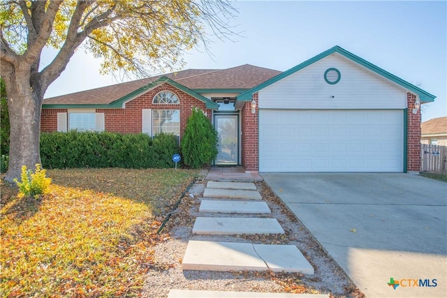 single story home featuring a garage