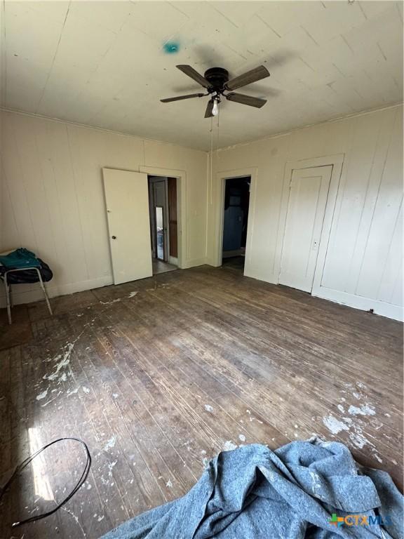 205 S Chestnut, Lampasas, TX 76550 - unfurnished bedroom featuring hardwood / wood-style floors and ceiling fan