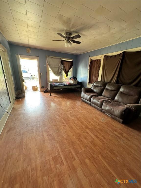 205 S Chestnut, Lampasas, TX 76550 - living area featuring a ceiling fan and wood finished floors