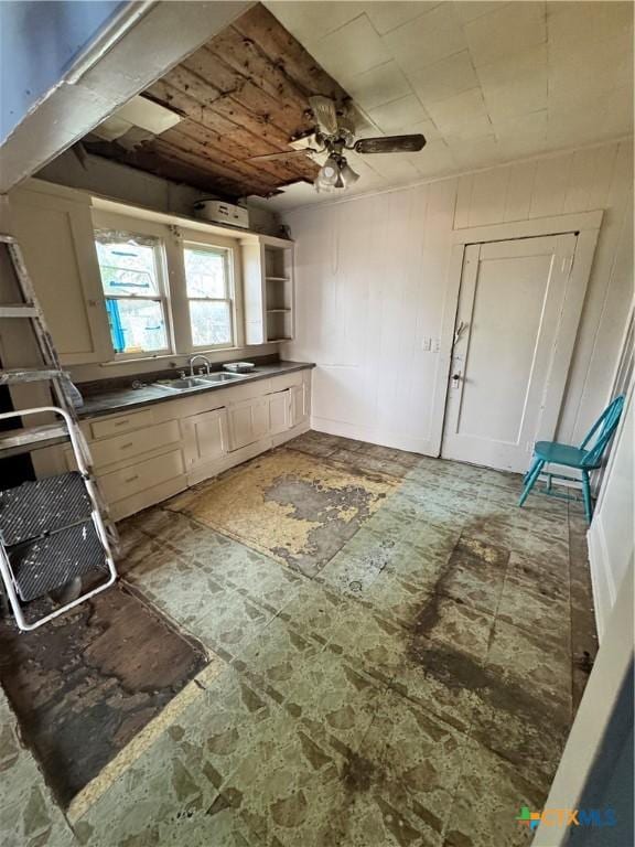 205 S Chestnut, Lampasas, TX 76550 - kitchen with a sink, dark countertops, and a ceiling fan