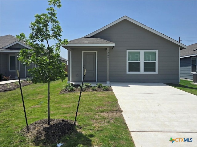 209 Tugboat Annie Way, Jarrell, TX 76537 - view of front of property with a front lawn