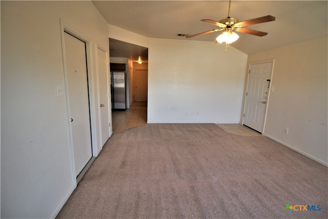 carpeted empty room featuring ceiling fan