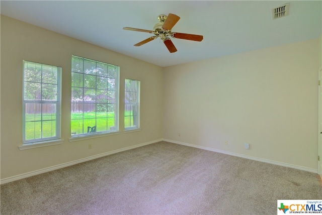 unfurnished room with light colored carpet