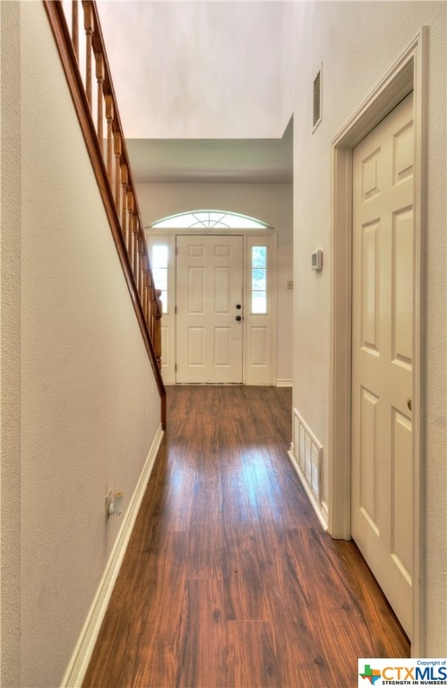 entrance foyer with dark hardwood / wood-style flooring