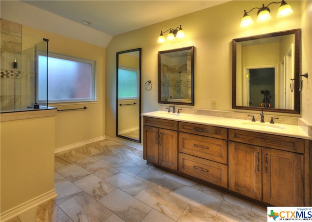 bathroom with walk in shower, vanity, and vaulted ceiling