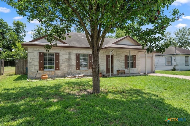 1503 Prather St, Taylor, TX 76574 - ranch-style home with an attached garage, stone siding, and driveway
