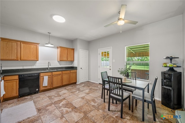 1503 Prather St, Taylor, TX 76574 - kitchen with black dishwasher, a ceiling fan, dark countertops, and pendant lighting