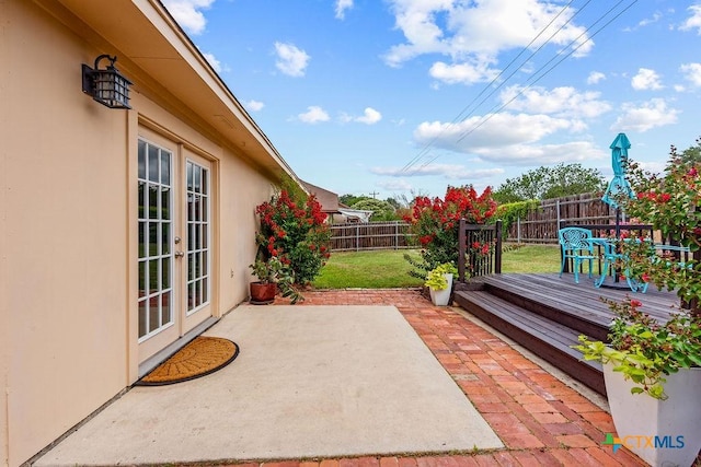 2075 Sungate Dr, New Braunfels, TX 78130 - fenced backyard featuring french doors, a patio area, and a deck