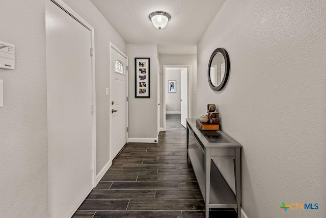 2075 Sungate Dr, New Braunfels, TX 78130 - hall featuring dark wood finished floors and baseboards