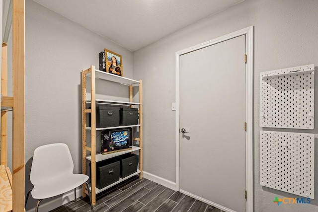 2075 Sungate Dr, New Braunfels, TX 78130 - home office with dark wood finished floors and baseboards
