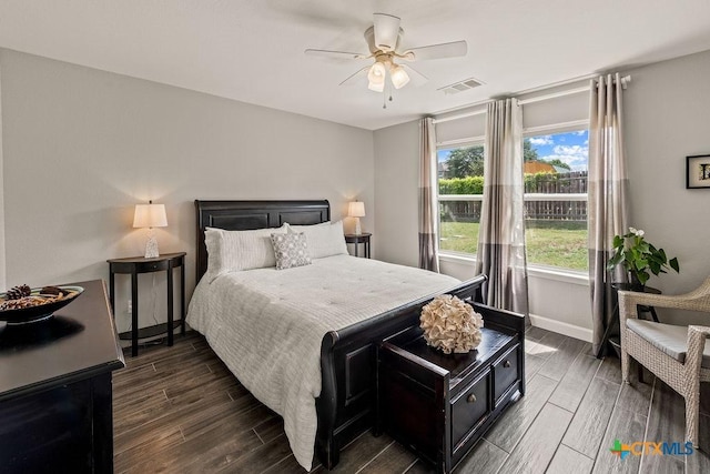 2075 Sungate Dr, New Braunfels, TX 78130 - bedroom with dark wood-style floors and a ceiling fan