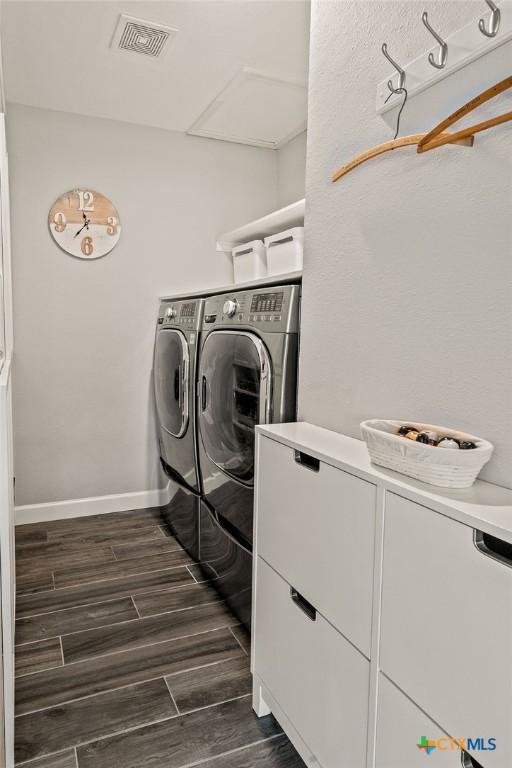 2075 Sungate Dr, New Braunfels, TX 78130 - laundry area with washing machine and clothes dryer and dark wood-type flooring