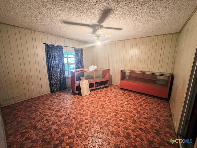 1606 Milam Dr, Victoria, TX 77901 - bedroom with wood walls and a ceiling fan