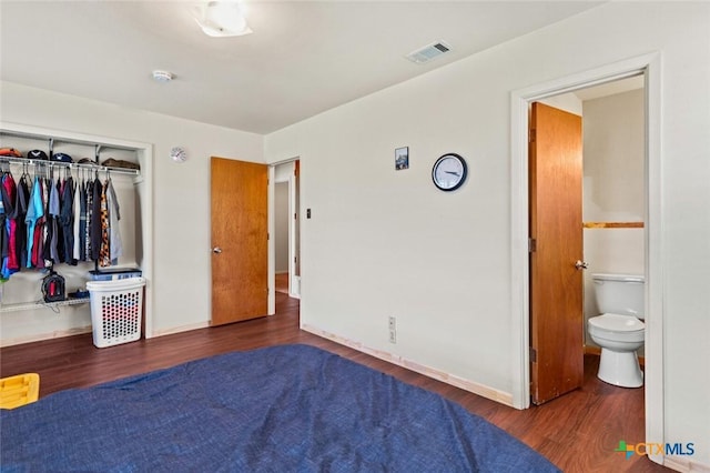 201 S Barbara St, Waco, TX 76705 - bedroom featuring wood finished floors, a closet, and connected bathroom