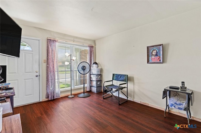 201 S Barbara St, Waco, TX 76705 - sitting room with wood finished floors and baseboards