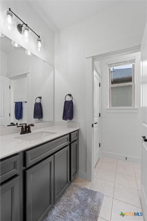 bathroom featuring tile patterned floors and vanity