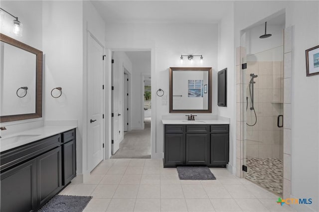 1604 Hinterwald St, Leander, TX 78641 - full bath with a shower stall, two vanities, and tile patterned flooring