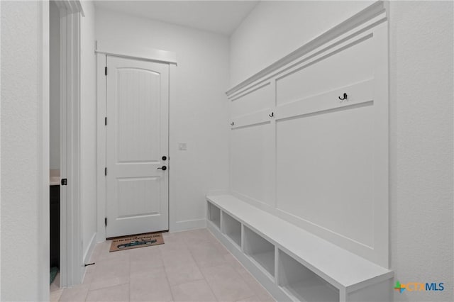 mudroom with light tile patterned flooring