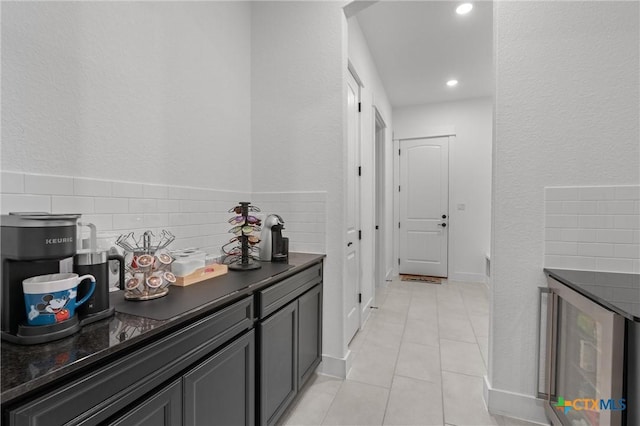 1604 Hinterwald St, Leander, TX 78641 - hall with wine cooler, light tile patterned floors, recessed lighting, and a textured wall