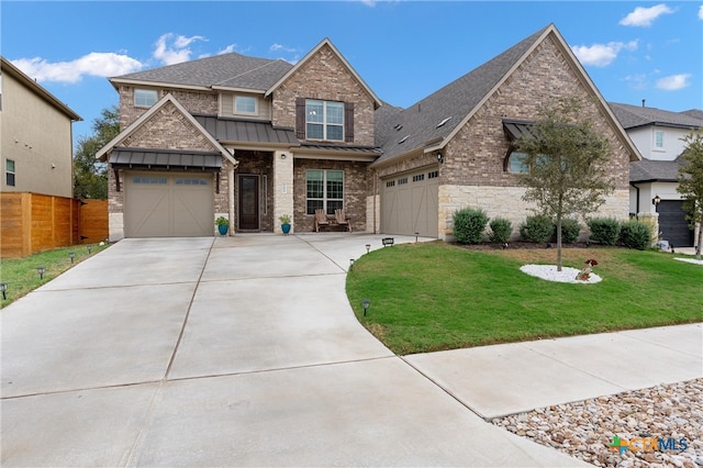 craftsman inspired home with a front yard and a garage