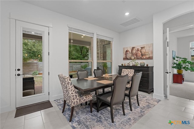 1604 Hinterwald St, Leander, TX 78641 - dining space featuring recessed lighting, light tile patterned floors, and arched walkways
