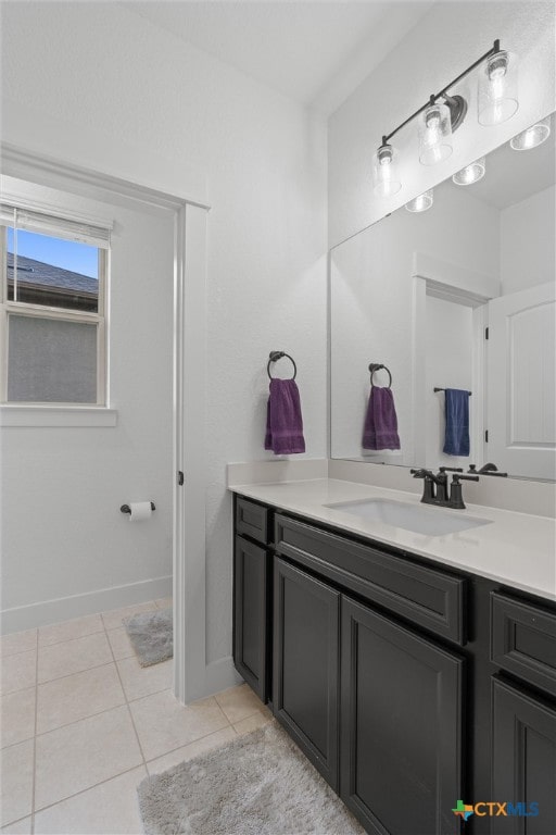 bathroom with tile patterned flooring and vanity