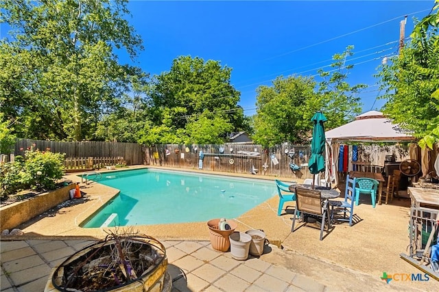 612 S 1st St, Copperas Cove, TX 76522 - view of pool featuring a gazebo, a fire pit, a patio, and a fenced backyard