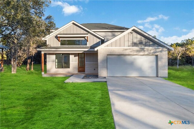 view of front facade featuring a garage, board and batten siding, and a front yard