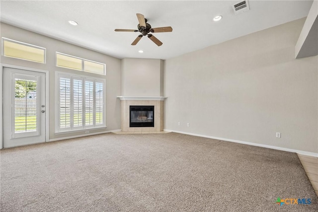 816 Woodhollow Dr, Temple, TX 76502 - unfurnished living room featuring a ceiling fan, a tile fireplace, recessed lighting, and carpet floors